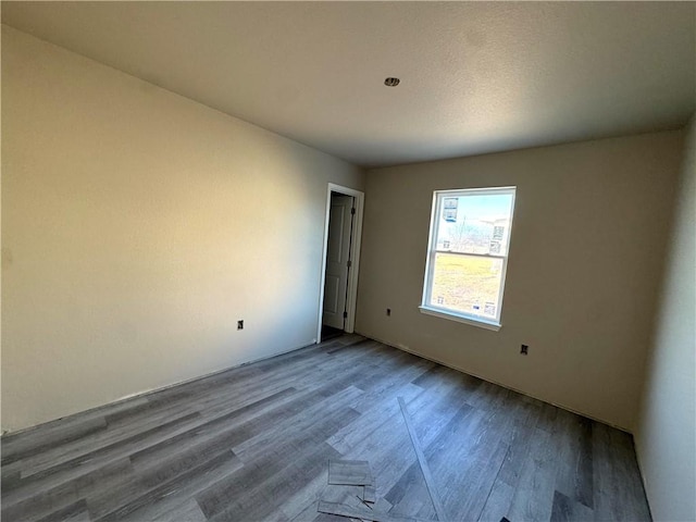 spare room with hardwood / wood-style flooring