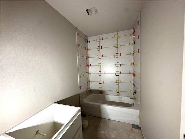 bathroom with shower / bathtub combination, vanity, and concrete floors