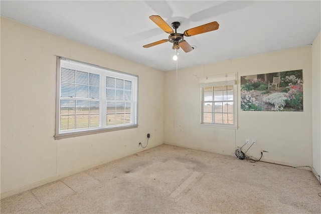 unfurnished room with light carpet and ceiling fan