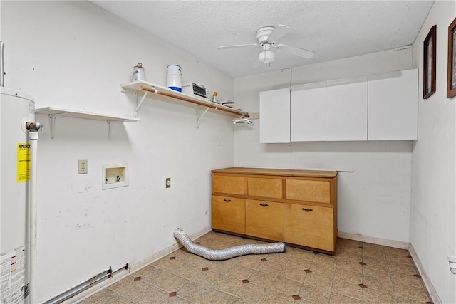 laundry area featuring cabinets, hookup for a washing machine, ceiling fan, a textured ceiling, and gas water heater