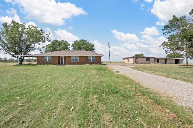 ranch-style house featuring a front lawn