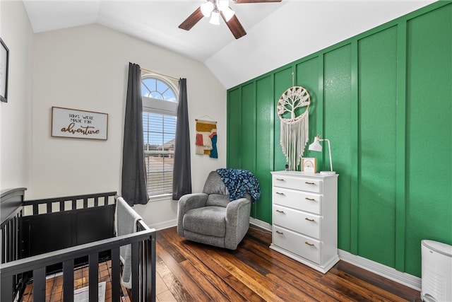 bedroom with vaulted ceiling, baseboards, dark wood-type flooring, and ceiling fan