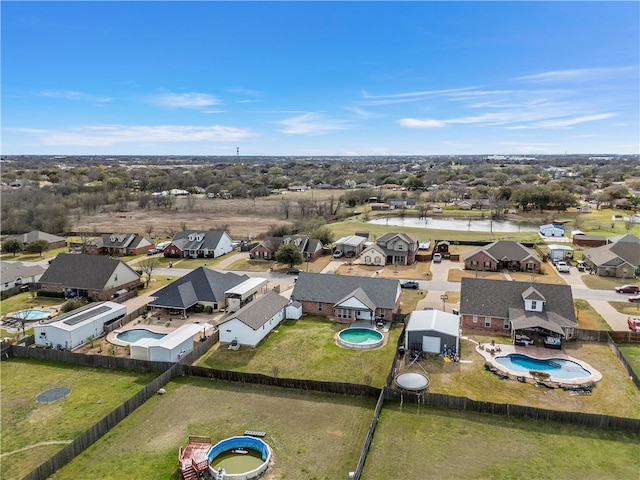 birds eye view of property with a residential view