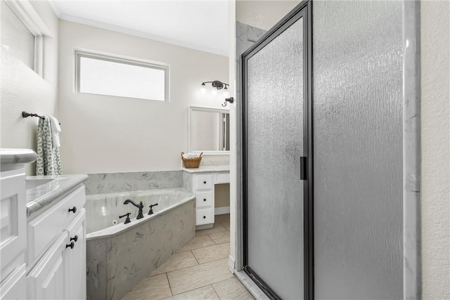 bathroom with vanity, a shower stall, tile patterned floors, and a whirlpool tub