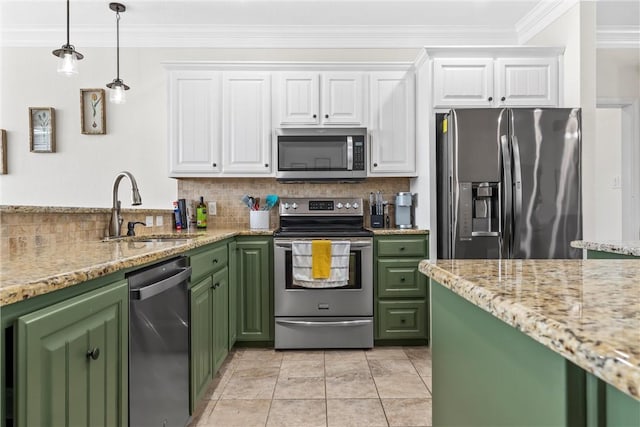 kitchen featuring green cabinetry, white cabinetry, appliances with stainless steel finishes, and a sink