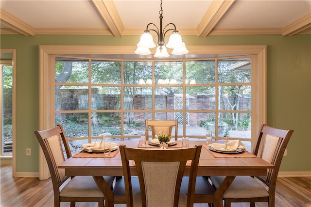 dining space featuring a notable chandelier, crown molding, wood-type flooring, and beamed ceiling