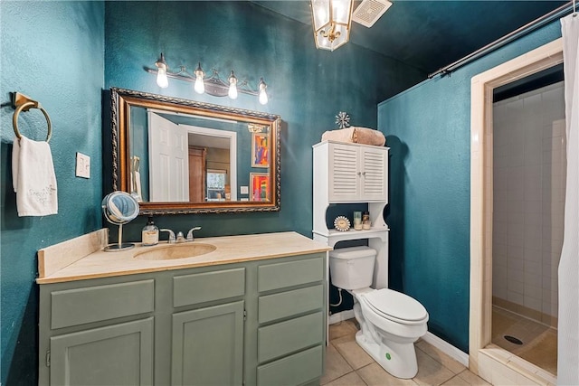 bathroom featuring tile patterned flooring, vanity, a shower with shower curtain, and toilet