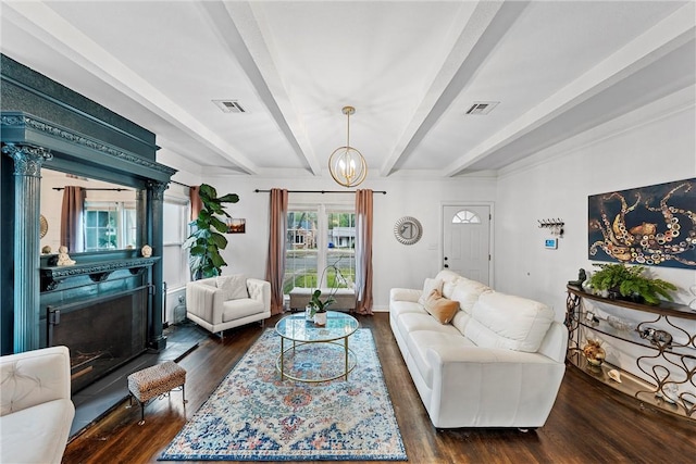 living room with beamed ceiling, dark hardwood / wood-style flooring, and a notable chandelier