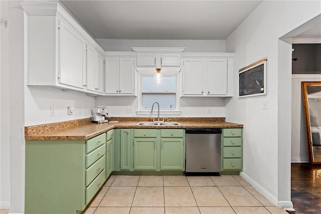 kitchen with dishwasher, white cabinets, green cabinets, sink, and light tile patterned flooring