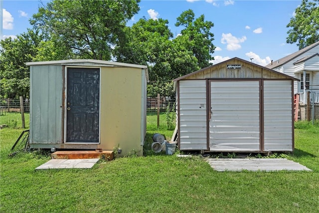 view of outbuilding featuring a lawn