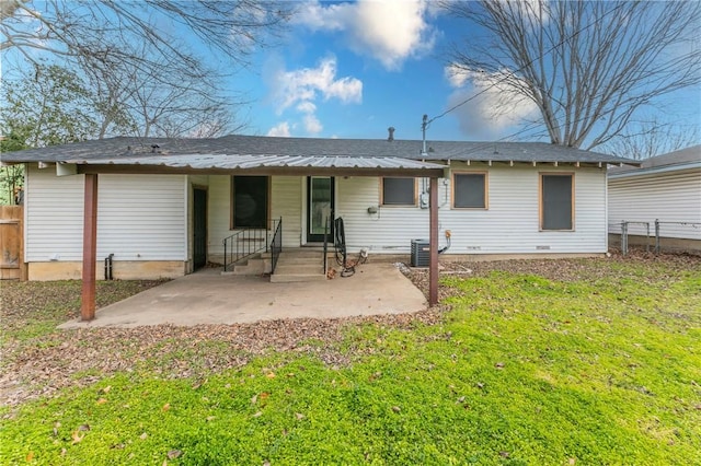 back of property featuring a yard and a patio