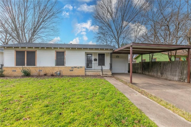 ranch-style house featuring a carport, a garage, and a front lawn