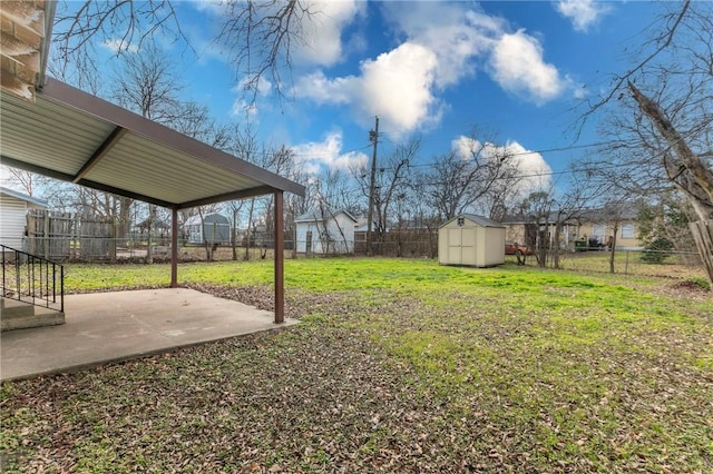 view of yard with a patio and a shed