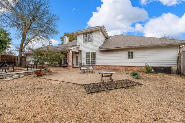 back of house with a patio