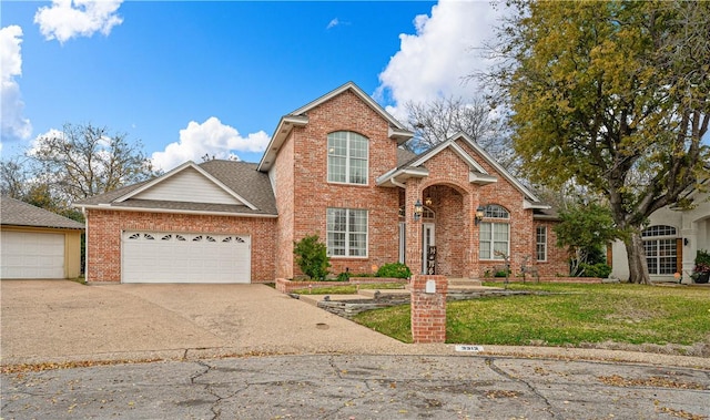 front of property with a front yard and a garage