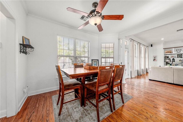 miscellaneous room with light hardwood / wood-style floors and ornamental molding