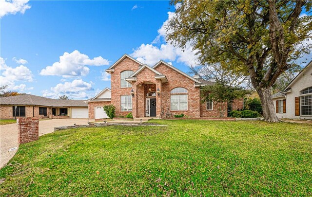 view of front property with a front lawn and a garage