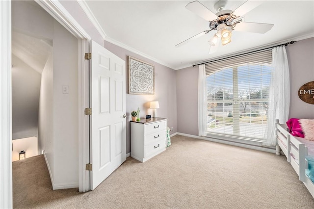 interior space with ceiling fan and ornamental molding