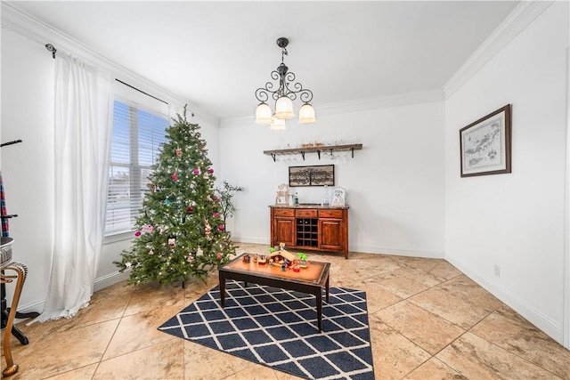 dining area featuring crown molding and a chandelier