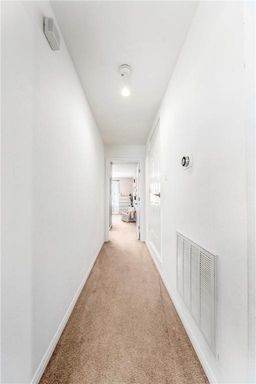 bedroom featuring ceiling fan and light colored carpet