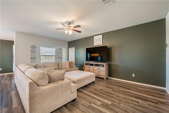 living room featuring ceiling fan and wood-type flooring