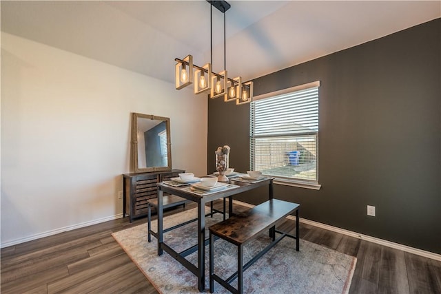 dining area featuring dark hardwood / wood-style flooring