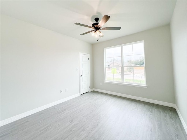 unfurnished room with ceiling fan and light hardwood / wood-style flooring