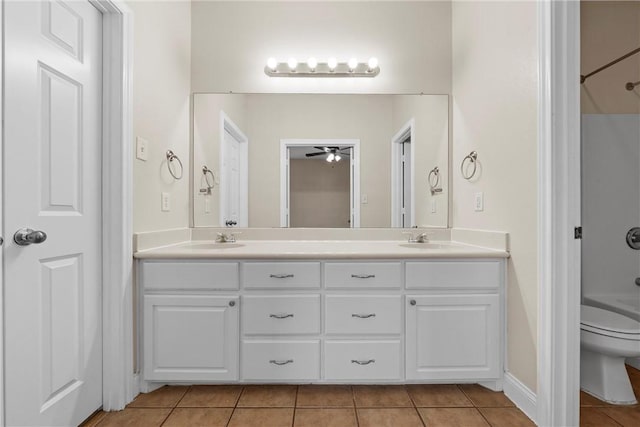 full bathroom featuring tile patterned flooring, vanity, toilet, and shower / bath combination