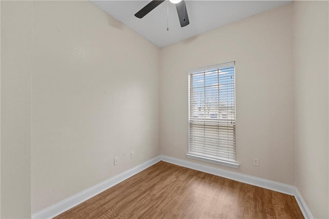 spare room featuring hardwood / wood-style floors and ceiling fan