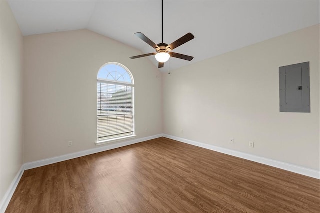 empty room with wood-type flooring, lofted ceiling, electric panel, and ceiling fan