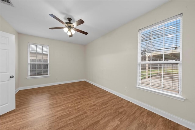 unfurnished room with wood-type flooring and ceiling fan