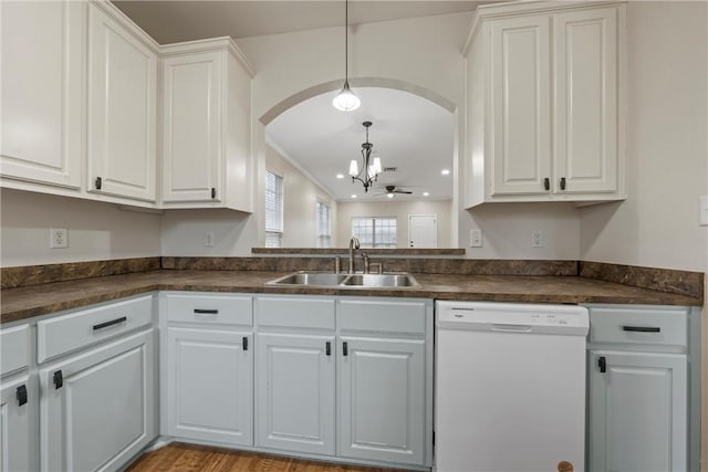 kitchen with white cabinetry, white dishwasher, sink, and hanging light fixtures