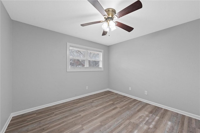 empty room featuring light hardwood / wood-style floors and ceiling fan