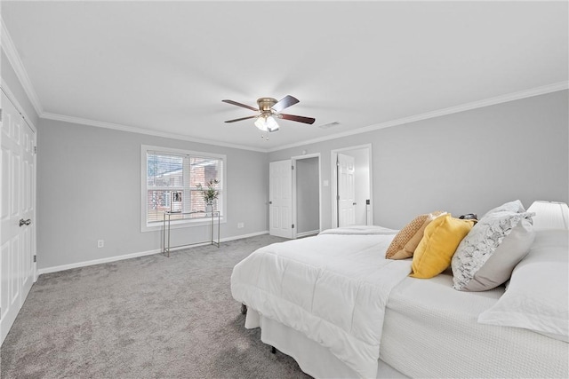 carpeted bedroom with crown molding and ceiling fan