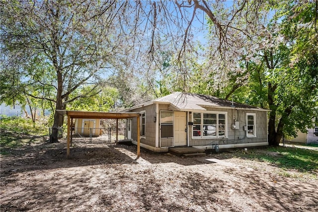 view of front of home with a carport