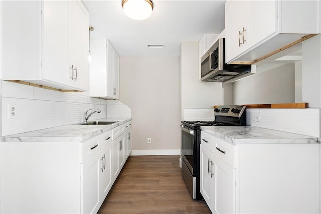 kitchen featuring sink, white cabinetry, and stainless steel appliances