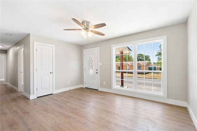 entrance foyer featuring light wood-type flooring and ceiling fan