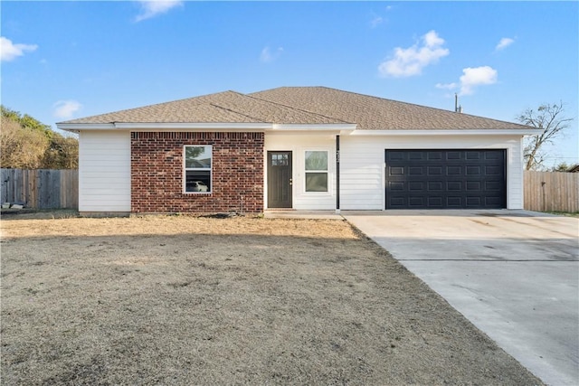 ranch-style home featuring a garage