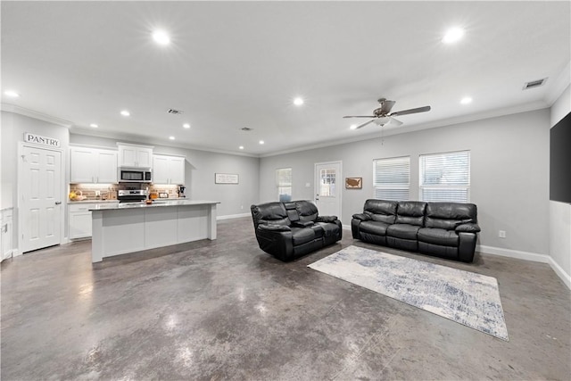 living room with ornamental molding and ceiling fan