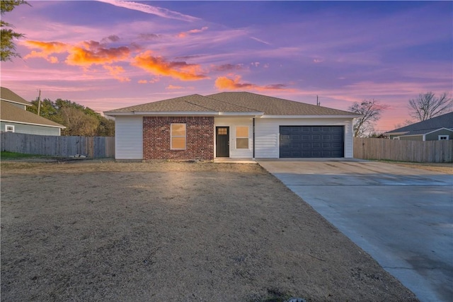 ranch-style home featuring a garage