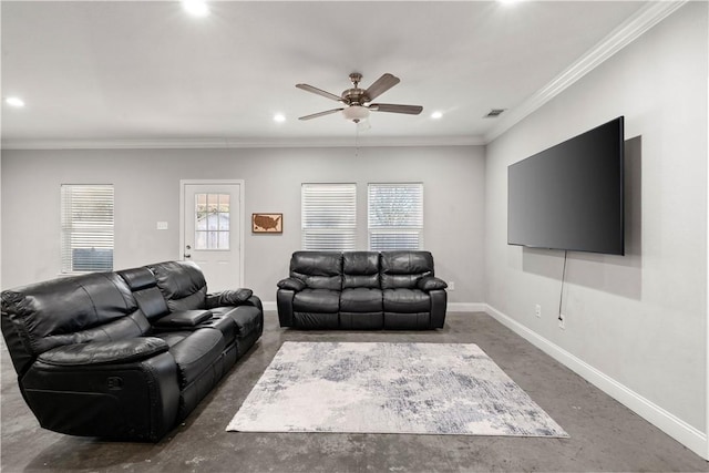 living room featuring crown molding, a wealth of natural light, and ceiling fan