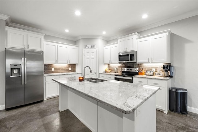 kitchen with white cabinetry, sink, an island with sink, and appliances with stainless steel finishes