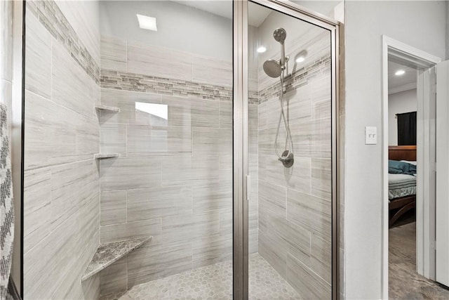 bathroom with a shower with door