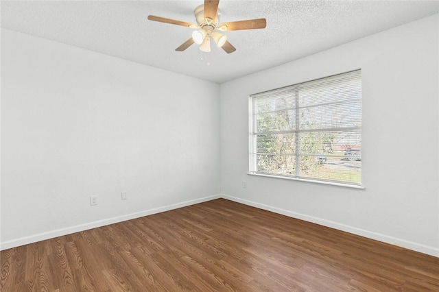 empty room featuring hardwood / wood-style floors, ceiling fan, and a textured ceiling