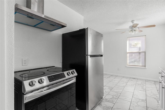 kitchen with wall chimney exhaust hood, a textured ceiling, stainless steel appliances, ceiling fan, and white cabinetry