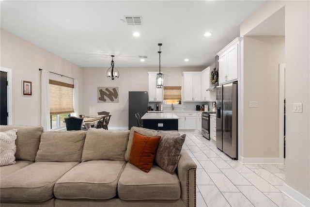 living room with light tile patterned floors