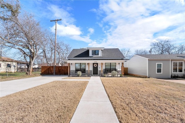 view of front of house with a front lawn and a porch