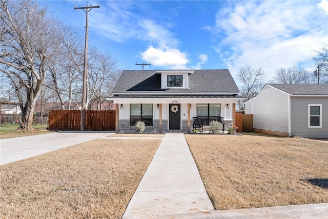 view of front of house featuring a front yard and a porch