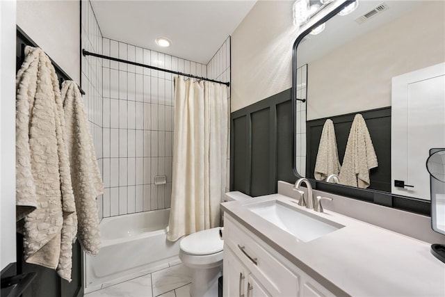 full bathroom featuring vanity, toilet, and shower / bath combo with shower curtain