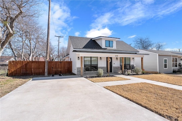 view of front of home with a porch and a front yard